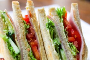 Salad and meat white bread sandwiches