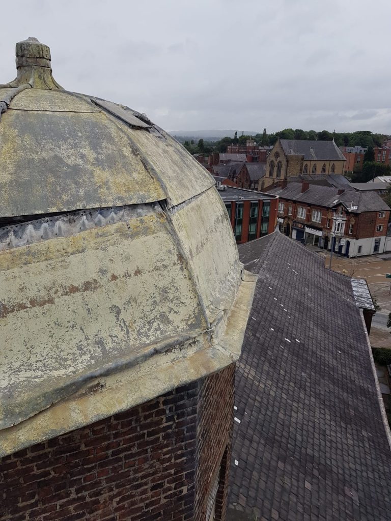 St peter's tower roof with a view of the chr=urch roof below